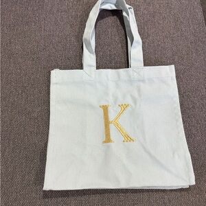 Monogram 'K' White Canvas Tote Bag with Gold Lettering